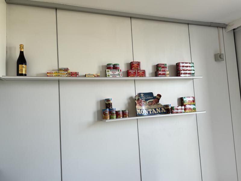 Canned goods on a shelf.